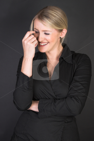 To use this stock image in your creative project, please select the size you need over to the right and click the "Add to Cart" button.
Your downloaded image will come with the Cutcaster watermark removed so don’t worry about the watermark you see on this page. Beautiful Businesswoman stock photo, Laughing Blond Businesswoman against a black background by Carla Booysen