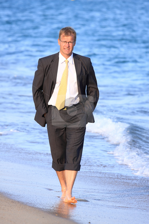 To use this stock image in your creative project, please select the size you need over to the right and click the "Add to Cart" button.
Your downloaded image will come with the Cutcaster watermark removed so don’t worry about the watermark you see on this page. Businessman stock photo, Happy young man walks close to the sea by ARPAD RADOCZY