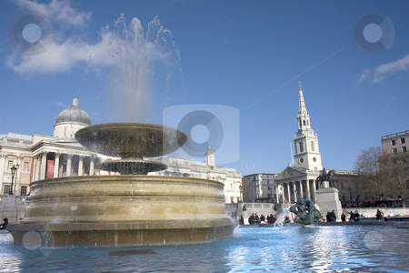 To use this stock image in your creative project, please select the size you need over to the right and click the "Add to Cart" button.
Your downloaded image will come with the Cutcaster watermark removed so don’t worry about the watermark you see on this page. Trafalgar Square fountain stock photo, Close up of a fountain in Trafalgar Square with the National Gallery and St Martins in the Field in the background. by Darren Pattterson