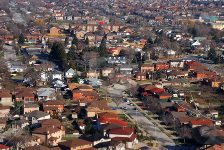 To use this stock image in your creative project, please select the size you need over to the right and click the "Add to Cart" button.
Your downloaded image will come with the Cutcaster watermark removed so don’t worry about the watermark you see on this page. Urban Landscape stock photo, Aerial view of an urban neighborhood by Tim Elliott