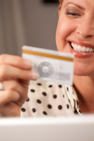 To use this stock image in your creative project, please select the size you need over to the right and click the "Add to Cart" button.
Your downloaded image will come with the Cutcaster watermark removed so don’t worry about the watermark you see on this page. Beautiful Woman Using Laptop Holding Her Credit Card stock photo, Beautiful Woman on Her Laptop Holding Her Credit Card. by Andy Dean