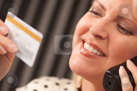To use this stock image in your creative project, please select the size you need over to the right and click the "Add to Cart" button.
Your downloaded image will come with the Cutcaster watermark removed so don’t worry about the watermark you see on this page. Beautiful Woman on Phone Holding Credit Card stock photo, Beautiful Woman on the Phone Holding Her Credit Card. by Andy Dean