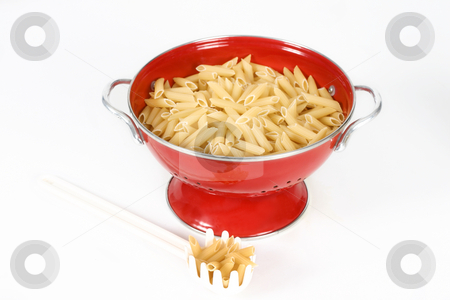To use this stock image in your creative project, please select the size you need over to the right and click the "Add to Cart" button.
Your downloaded image will come with the Cutcaster watermark removed so don’t worry about the watermark you see on this page. Pasta shells in colander stock photo, Penne pasta shells (uncookded) sitting in a red colander with a white plastic pasta spoon laid beside on a white background. by Leah-Anne Thompson