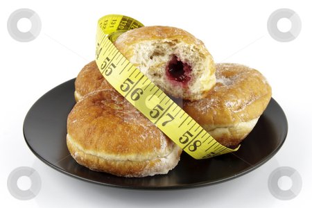 To use this stock image in your creative project, please select the size you need over to the right and click the "Add to Cart" button.
Your downloaded image will come with the Cutcaster watermark removed so don’t worry about the watermark you see on this page. Doughnuts and Tape Measure stock photo, Black round plate of jam doughnuts with a yellow tape measure on a reflective white background by Keith Wilson