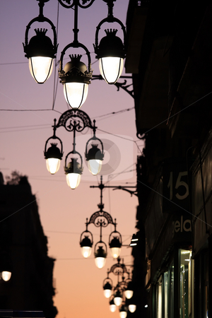 To use this stock image in your creative project, please select the size you need over to the right and click the "Add to Cart" button.
Your downloaded image will come with the Cutcaster watermark removed so don’t worry about the watermark you see on this page. Street lamp stock photo, In Barcelona is a street lamp series by ARPAD RADOCZY