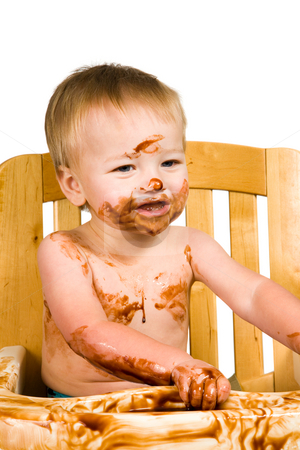 To use this stock image in your creative project, please select the size you need over to the right and click the "Add to Cart" button.
Your downloaded image will come with the Cutcaster watermark removed so don’t worry about the watermark you see on this page. Messy Baby Boy Isolated stock photo, A portrait of a messy baby boy isolated eating chocolate. by Travis Manley