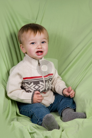 To use this stock image in your creative project, please select the size you need over to the right and click the "Add to Cart" button.
Your downloaded image will come with the Cutcaster watermark removed so don’t worry about the watermark you see on this page. Toddler in Winter Clothes stock photo, A portrait of a cute toddler dressed in winter clothes. by Travis Manley