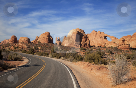 To use this stock image in your creative project, please select the size you need over to the right and click the "Add to Cart" button.
Your downloaded image will come with the Cutcaster watermark removed so don’t worry about the watermark you see on this page. Arches National Park stock photo, View of the red rock formations in Arches National Park with blue sky by Mark Smith