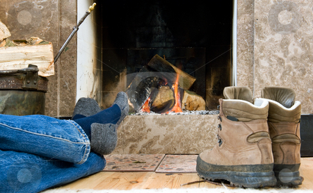 To use this stock image in your creative project, please select the size you need over to the right and click the "Add to Cart" button.
Your downloaded image will come with the Cutcaster watermark removed so don’t worry about the watermark you see on this page. Hiker resting by the fireplace stock photo, Hiker warming up and relaxing by a small fireplace by Corepics VOF