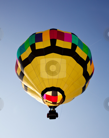 To use this stock image in your creative project, please select the size you need over to the right and click the "Add to Cart" button.
Your downloaded image will come with the Cutcaster watermark removed so don’t worry about the watermark you see on this page. Hot air balloon soaring into the sky stock photo, Yellow hot air balloon soaring skyward towards the sun by Steven Heap