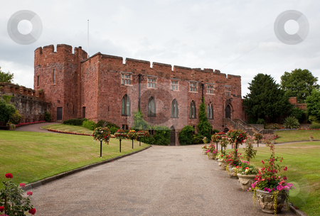 To use this stock image in your creative project, please select the size you need over to the right and click the "Add to Cart" button.
Your downloaded image will come with the Cutcaster watermark removed so don’t worry about the watermark you see on this page. Shrewsbury Castle with floral driveway stock photo, Gravel drive to Shrewsbury Castle lined with flowers by Steven Heap