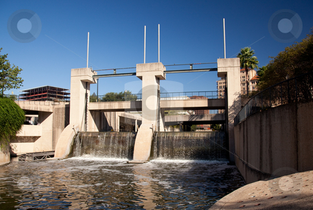 To use this stock image in your creative project, please select the size you need over to the right and click the "Add to Cart" button.
Your downloaded image will come with the Cutcaster watermark removed so don’t worry about the watermark you see on this page. Dam on the river in San Antonio stock photo, Concrete construction aimed at controlling flooding of San Antonio River and the walk by Steven Heap
