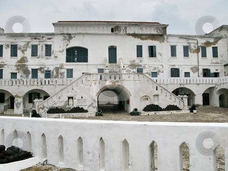 To use this stock image in your creative project, please select the size you need over to the right and click the "Add to Cart" button.
Your downloaded image will come with the Cutcaster watermark removed so don’t worry about the watermark you see on this page. Elmina Castle in Ghana entrance stock photo, Elmina Castle was the exit port for slaves from Ghana in Africa. This is the entrance to the cells by Steven Heap