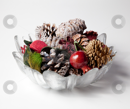 To use this stock image in your creative project, please select the size you need over to the right and click the "Add to Cart" button.
Your downloaded image will come with the Cutcaster watermark removed so don’t worry about the watermark you see on this page. Glass vase holding scented cones stock photo, Christmas or thanksgiving decoration with scented cones and nuts in a glass vase by Steven Heap