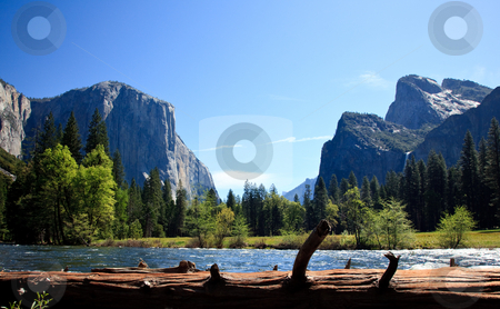 To use this stock image in your creative project, please select the size you need over to the right and click the "Add to Cart" button.
Your downloaded image will come with the Cutcaster watermark removed so don’t worry about the watermark you see on this page. View into Yosemite Valley from Merced River stock photo, Cedar colored log frames the entrance into Yosemite Valley by Steven Heap