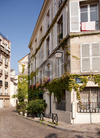 To use this stock image in your creative project, please select the size you need over to the right and click the "Add to Cart" button.
Your downloaded image will come with the Cutcaster watermark removed so don’t worry about the watermark you see on this page. Old cobbled street in Montmartre in Paris stock photo, Old Parisian street with blossoms and cobbled road in suburb of Montmartre by Steven Heap