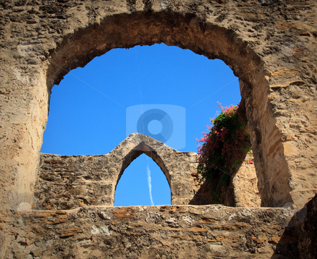 To use this stock image in your creative project, please select the size you need over to the right and click the "Add to Cart" button.
Your downloaded image will come with the Cutcaster watermark removed so don’t worry about the watermark you see on this page. Arches of San Juan Mission in Texas stock photo, View of an old arch in San Juan Mission in Texas with modern jet trail in sky by Steven Heap