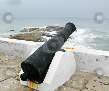 To use this stock image in your creative project, please select the size you need over to the right and click the "Add to Cart" button.
Your downloaded image will come with the Cutcaster watermark removed so don’t worry about the watermark you see on this page. Elmina castle rusty gun overlooking ocean stock photo, Elmina Castle was the exit port for slaves from Ghana in Africa. This is a rusted cannon by Steven Heap