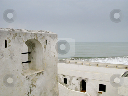 To use this stock image in your creative project, please select the size you need over to the right and click the "Add to Cart" button.
Your downloaded image will come with the Cutcaster watermark removed so don’t worry about the watermark you see on this page. Elmina Castle in Ghana near Accra stock photo, Elmina Castle was the exit port for slaves from Ghana in Africa. This shows the roof and battlements by Steven Heap