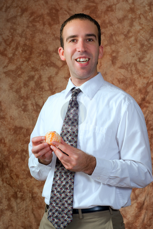 To use this stock image in your creative project, please select the size you need over to the right and click the "Add to Cart" button.
Your downloaded image will come with the Cutcaster watermark removed so don’t worry about the watermark you see on this page. Businessman Having Orange For Snack stock photo, A businessman wearing a tie is going to eat a peeled orange for a snack by Richard Nelson
