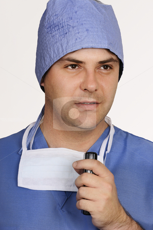 To use this stock image in your creative project, please select the size you need over to the right and click the "Add to Cart" button.
Your downloaded image will come with the Cutcaster watermark removed so don’t worry about the watermark you see on this page. Surgeon speaking stock photo, Surgeon at work - eg: autopsy findings. by Leah-Anne Thompson