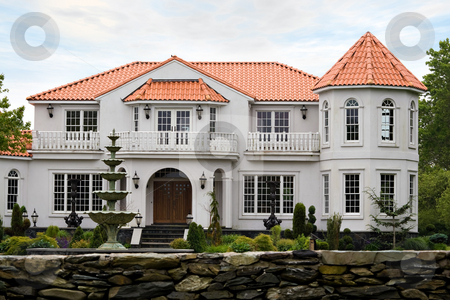 To use this stock image in your creative project, please select the size you need over to the right and click the "Add to Cart" button.
Your downloaded image will come with the Cutcaster watermark removed so don’t worry about the watermark you see on this page. Luxury Mansion stock photo, A large mansion with classic architecture and a clay tile roof. by Todd Arena