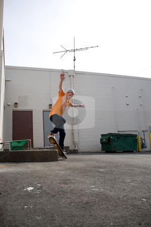 To use this stock image in your creative project, please select the size you need over to the right and click the "Add to Cart" button.
Your downloaded image will come with the Cutcaster watermark removed so don’t worry about the watermark you see on this page. Skateboarder Grinding stock photo, Portrait of a young skateboarder performing a trick in an urban setting. by Todd Arena