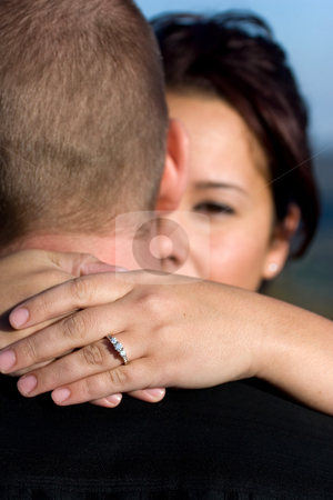 To use this stock image in your creative project, please select the size you need over to the right and click the "Add to Cart" button.
Your downloaded image will come with the Cutcaster watermark removed so don’t worry about the watermark you see on this page. Engaged Couple stock photo, A young happy couple that just got engaged. Shallow depth of field with focus on the diamond engagement ring. by Todd Arena