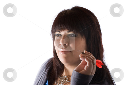 To use this stock image in your creative project, please select the size you need over to the right and click the "Add to Cart" button.
Your downloaded image will come with the Cutcaster watermark removed so don’t worry about the watermark you see on this page. Throwing a Dart stock photo, A young woman aiming a dart as she gets ready to throw it at the target. Shallow depth of field. by Todd Arena