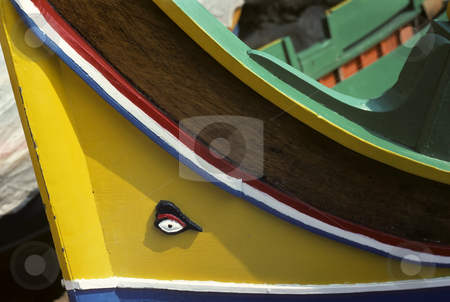 To use this stock image in your creative project, please select the size you need over to the right and click the "Add to Cart" button.
Your downloaded image will come with the Cutcaster watermark removed so don’t worry about the watermark you see on this page. Yellow sailing boat stock photo, Bow of wooden sailing boat with carved eye on the prow by Steven Heap