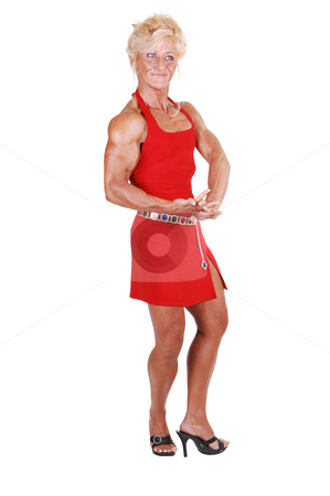 To use this stock image in your creative project, please select the size you need over to the right and click the "Add to Cart" button.
Your downloaded image will come with the Cutcaster watermark removed so don’t worry about the watermark you see on this page. Bodybuilding woman. stock photo, An blond bodybuilding girl standing in a studio in a red dress and shooing
her very muscular body with high heels, over white background. by Horst Petzold