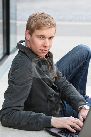 To use this stock image in your creative project, please select the size you need over to the right and click the "Add to Cart" button.
Your downloaded image will come with the Cutcaster watermark removed so don’t worry about the watermark you see on this page. Young man with laptop stock photo, Young blond handsome man with laptop computer in a relaxed pose outdoors by Mikhail Lavrenov
