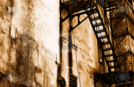 To use this stock image in your creative project, please select the size you need over to the right and click the "Add to Cart" button.
Your downloaded image will come with the Cutcaster watermark removed so don’t worry about the watermark you see on this page. Old escape stock photo, An old fire escape in an alley by Gerry Daniel