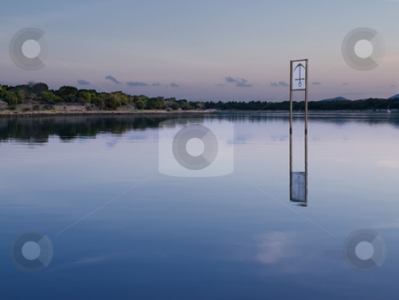 To use this stock image in your creative project, please select the size you need over to the right and click the "Add to Cart" button.
Your downloaded image will come with the Cutcaster watermark removed so don’t worry about the watermark you see on this page. A place to dock stock photo, Bay with the anchor sign-board in the shallow water , peaceful scene in the sunset by Vladimir Koletic