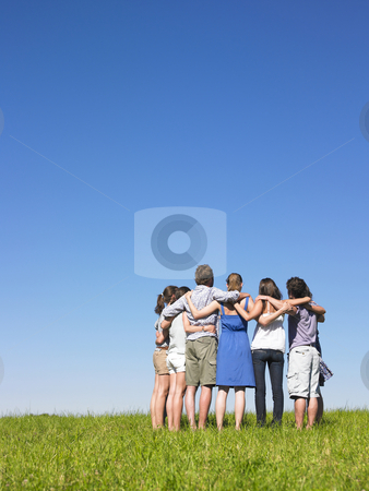 To use this stock image in your creative project, please select the size you need over to the right and click the "Add to Cart" button.
Your downloaded image will come with the Cutcaster watermark removed so don’t worry about the watermark you see on this page. Group in semicircle stock photo, Group of friends holding sholders in meadow under blue sky by Mog Ddl