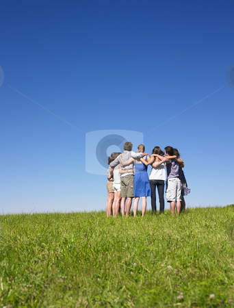 To use this stock image in your creative project, please select the size you need over to the right and click the "Add to Cart" button.
Your downloaded image will come with the Cutcaster watermark removed so don’t worry about the watermark you see on this page. Group of People in Huddle in Field stock photo, A group of people huddle in a field. Vertically framed shot. by Mog Ddl