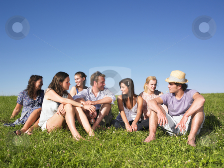 To use this stock image in your creative project, please select the size you need over to the right and click the "Add to Cart" button.
Your downloaded image will come with the Cutcaster watermark removed so don’t worry about the watermark you see on this page. Group sitting in meadow stock photo, Group of friends sitting in meadow under blue sky by Mog Ddl