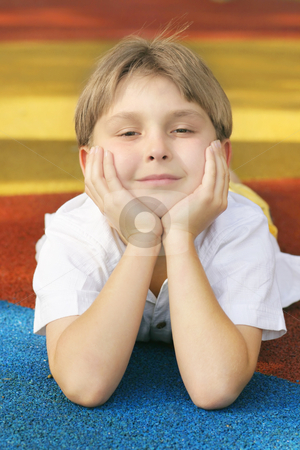 To use this stock image in your creative project, please select the size you need over to the right and click the "Add to Cart" button.
Your downloaded image will come with the Cutcaster watermark removed so don’t worry about the watermark you see on this page. Bright Future stock photo, Boy on colorful playground matting with a happy disposition / outlook. by Leah-Anne Thompson