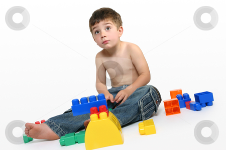 To use this stock image in your creative project, please select the size you need over to the right and click the "Add to Cart" button.
Your downloaded image will come with the Cutcaster watermark removed so don’t worry about the watermark you see on this page. Young boy amongst building blocks stock photo, Young boy sits amongst colourful generic building blocks. by Leah-Anne Thompson