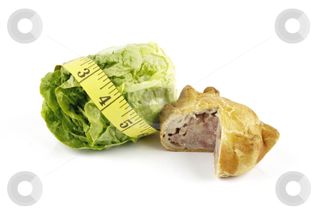 To use this stock image in your creative project, please select the size you need over to the right and click the "Add to Cart" button.
Your downloaded image will come with the Cutcaster watermark removed so don’t worry about the watermark you see on this page. Salad Lettace with Pork Pie and Tape Measure stock photo, Contradiction between healthy food and junk food using a green salad lettace and pork pie with a yellow tape measure on a reflective white background by Keith Wilson
