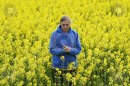 To use this stock image in your creative project, please select the size you need over to the right and click the "Add to Cart" button.
Your downloaded image will come with the Cutcaster watermark removed so don’t worry about the watermark you see on this page. Man in flower meadow stock photo, Happy young man in the yellow flower meadow. by Roberts Ratuts