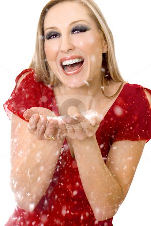 To use this stock image in your creative project, please select the size you need over to the right and click the "Add to Cart" button.
Your downloaded image will come with the Cutcaster watermark removed so don’t worry about the watermark you see on this page. Woman blowing soft flakes stock photo, Woman blowing soft flakes and laughing by Leah-Anne Thompson