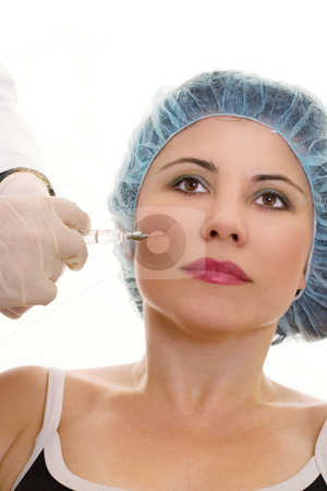 To use this stock image in your creative project, please select the size you need over to the right and click the "Add to Cart" button.
Your downloaded image will come with the Cutcaster watermark removed so don’t worry about the watermark you see on this page. Collagen Injection stock photo, A woman receives a collagen or hyaluronic acid filler. by Leah-Anne Thompson