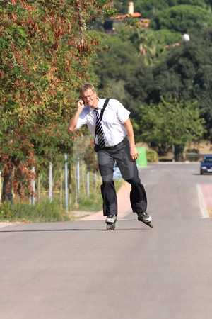 To use this stock image in your creative project, please select the size you need over to the right and click the "Add to Cart" button.
Your downloaded image will come with the Cutcaster watermark removed so don’t worry about the watermark you see on this page. Young businessman stock photo, A young businessman with a roller skate by ARPAD RADOCZY