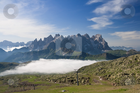 To use this stock image in your creative project, please select the size you need over to the right and click the "Add to Cart" button.
Your downloaded image will come with the Cutcaster watermark removed so don’t worry about the watermark you see on this page. Morning in Dolomites stock photo, Summer view of dolomites mountain with cableway near San Pellegrino pass, Trentino, Italy. On the background Pale San Martino mountain. by ANTONIO SCARPI