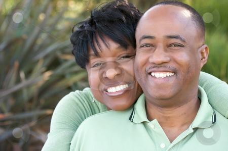 To use this stock image in your creative project, please select the size you need over to the right and click the "Add to Cart" button.
Your downloaded image will come with the Cutcaster watermark removed so don’t worry about the watermark you see on this page. Attractive Happy African American Couple stock photo, Attractive and Affectionate African American Couple posing in the park. by Andy Dean