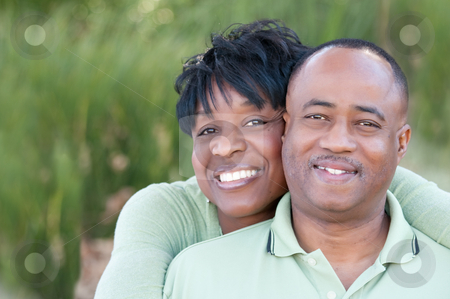 To use this stock image in your creative project, please select the size you need over to the right and click the "Add to Cart" button.
Your downloaded image will come with the Cutcaster watermark removed so don’t worry about the watermark you see on this page. Attractive Happy African American Couple stock photo, Attractive and Affectionate African American Couple posing in the park. by Andy Dean