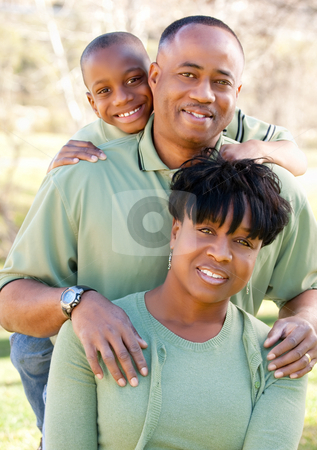 To use this stock image in your creative project, please select the size you need over to the right and click the "Add to Cart" button.
Your downloaded image will come with the Cutcaster watermark removed so don’t worry about the watermark you see on this page. Attractive African American Man, Woman and Child stock photo, Attractive African American Man, Woman and Child posing in the park. by Andy Dean
