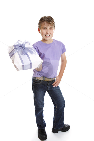 To use this stock image in your creative project, please select the size you need over to the right and click the "Add to Cart" button.
Your downloaded image will come with the Cutcaster watermark removed so don’t worry about the watermark you see on this page. Young boy holding present stock photo, A young boy dressed in jeans and t-shirt holds a present tied up with a big ribbon ow. by Leah-Anne Thompson