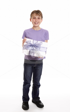 To use this stock image in your creative project, please select the size you need over to the right and click the "Add to Cart" button.
Your downloaded image will come with the Cutcaster watermark removed so don’t worry about the watermark you see on this page. Boy with a mother's day or birthday present stock photo, A boy smiles with a wrapped present tied up with big ribbon bow by Leah-Anne Thompson